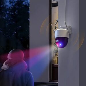 IMOU Cruiser SC outdoor camera with flashing red and blue warning lights and spotlight actively deterring a person at night, showcasing advanced security features.