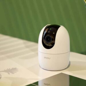 Close-up of the sleek IMOU Ranger 2 1080P indoor security camera on a white surface, showcasing its modern design and compact form factor.